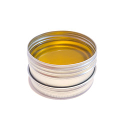 Jar with wax isolated on a white background. Body cream. Wax for hair removal. Depilation. Aromatic oil. Hygiene product. Body Oil. Hot cream. 