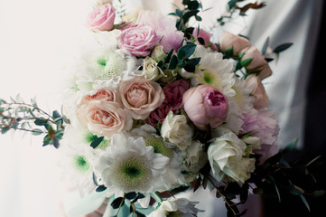 beautiful wedding bouquet of the bride of white roses
