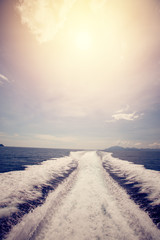 Water stream after speed boat in tropical ocean. vintage filter