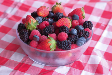 fresh berry fruits in a bowl on table