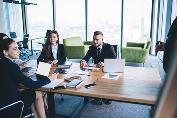 Business team listening to colleague speaking