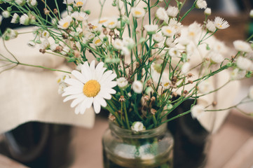 Beautiful bouquet of bright wildflowers with decorative elements