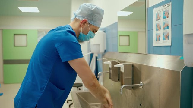 Doctor washing hands. Surgeon washing hands before operating