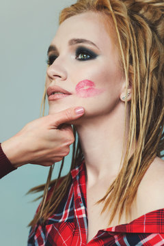 Portrait high fashion model false dreadlocks. Smokey eyes. Ethnic style. Cheeky image. Art salon concept. Lipstick kiss