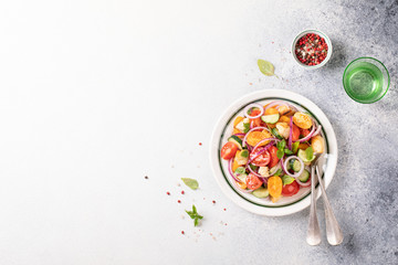 Fototapeta na wymiar Vegetable salad. Panzanella traditional food of Italy with tomatoes and bread.