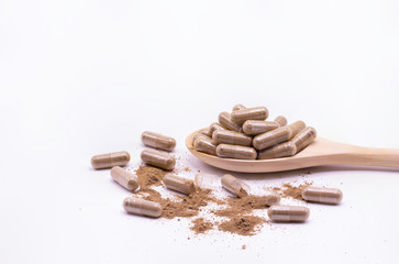 Close up herbal capsules isolate on white background.