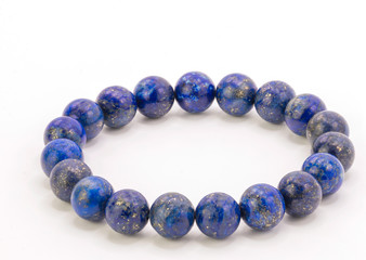 Close up  bracelet Lapis lazuli stone isolate on white background.Beautiful Lapis is blue stone beads.
