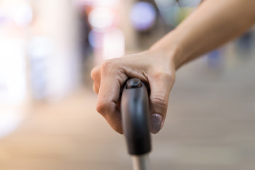 Hand hold travel bag during in airport terminal