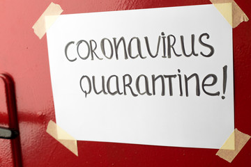 There is a quarantine sign on the door because of Coronavirus.