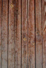 Fototapeta na wymiar Shabby old fence of red-brown colour background of wooden boards, in the style of rustic, grunge, old fashion