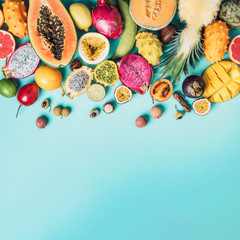 Tropical fruits concept. Exotic fruits - pineapple, papaya, mango, annona, banana, pitahaya,...