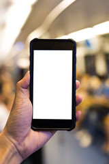 Hand hold blank smart phone on MRT train background
