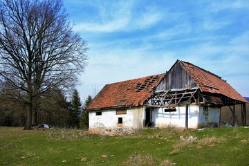 a ruined old house on the field