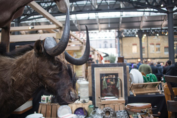 Spitalfields flea market. Bison head on a market background.