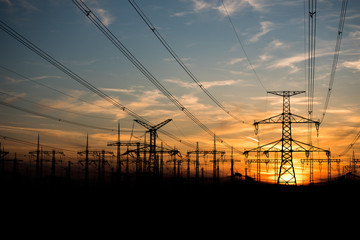 electricity pylons at sunset