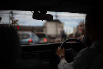 Fototapeta na wymiar man driving a car/taxi