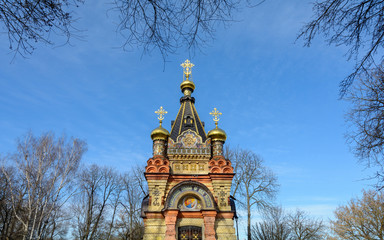 Fototapeta na wymiar Gomel Palace and Park Ensemble. View of the chapel-tomb of the Paskevich family. Carved stone and art metal, red terracotta and multicolor majolica, smalt mosaic and wall paintings.