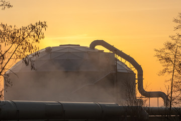 Fototapeta na wymiar Industrial Dome in the Morning Fog at Sunrise