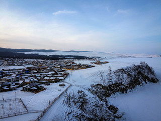 Khuzhir village aerial view by winter, Olkhon Island, frozen Baikal Lake, Russia