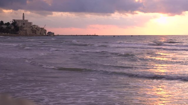 The Mediterranean Sea at sunset and view of Jaffa Port