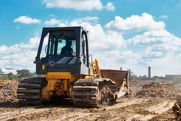 Obraz premium Buldozer moving earth. Road construction building work
