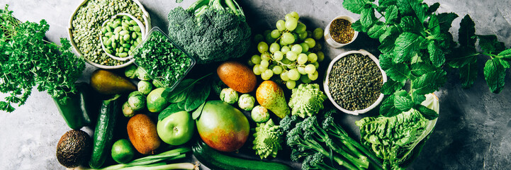 Variety of Green Vegetables and Fruits on the grey background, banner size