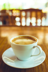 Hot latter coffee on wooden cafe table