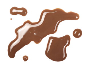 Spilled chocolate milk puddle isolated on white background, top view