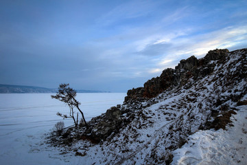 Frozen rocks of Olkhon Island view by winter, Baikal Lake, Russia