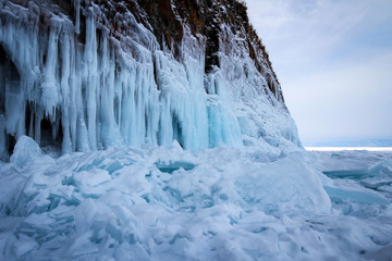 Scenic icicles view on rocks of Olkhon Island, Baikal Lake by winter, Russia