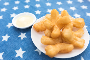 deep fried dough stick with sweet cream sauce