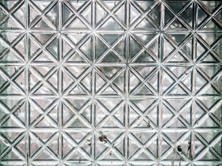 Glass of the squares pattern of an abandoned building