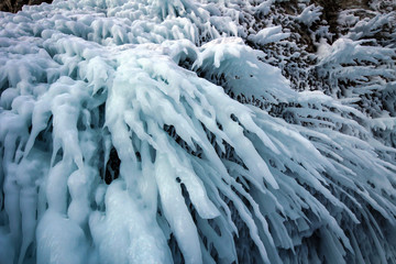 Scenic icicles view on stone cliffs, Olkhon Island, Baikal Lake, Russia