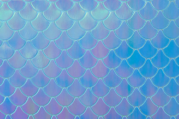 Abstract textured holographic background from leather surface, like mermaid or fish scales. Trendy multicolor texture with copy space. Celebration, holidays, fashion concept. Horizontal