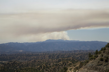 Fototapeta premium A California wildfire viewed from Lockwood Valley, Highway 33, near Ojai, California