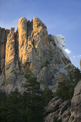 A profile at sunset of George Washington at Mount Rushmore National Memorial, South Dakota