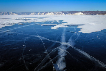 Scenic view of frozen Baikal Lake covered by snow near Listvyanka village, Russia