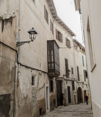 Fototapeta na wymiar Mallorca, Spain, January 25th 2020: A typical old street of the historic city center of Palma de Mallorca