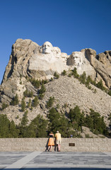 A man and woman at the Grand Terrace view of Mount Rushmore National Memorial, South Dakota