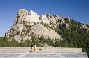 A man and woman at the Grand Terrace view of Mount Rushmore National Memorial, South Dakota