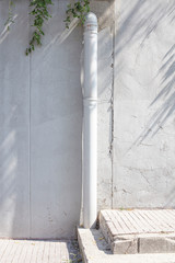 Obraz premium White plastic sewage water pipes on concrete wall