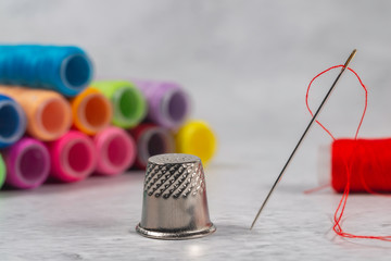 Close-up view of one needle with red thread