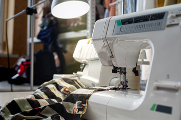 sewing and creating clothes in the studio