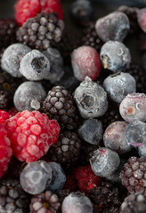 frozen raspberries, blackberries and blueberries close up