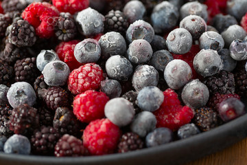 frozen raspberries, blackberries and blueberries close up