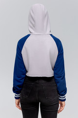 Woman in blue and gray mini hoodie, mockup for logo or branding design. Back side