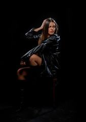 Trendy young brunette girl sitting on cheir