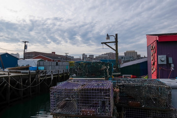 Fototapeta na wymiar Portland wharfs, fishermen/lobstermen equipment, boats, and nautical gear - Portland, Maine.