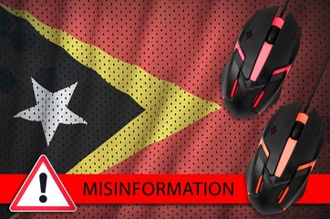 Timor Leste flag and two computer mouses. Misinformation during Coronavirus or 2019-nCov virus...