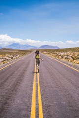 Woman running away on the highway